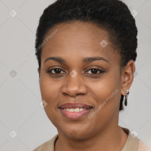 Joyful black young-adult female with short  brown hair and brown eyes