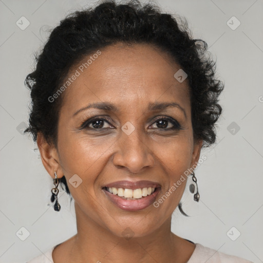 Joyful black adult female with short  brown hair and brown eyes