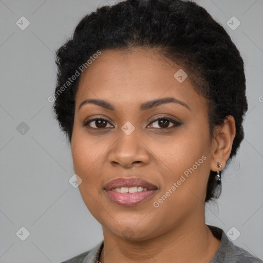 Joyful black young-adult female with short  black hair and brown eyes