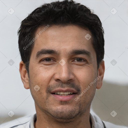 Joyful white young-adult male with short  black hair and brown eyes