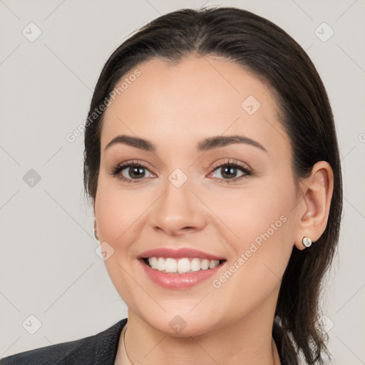 Joyful white young-adult female with medium  brown hair and brown eyes