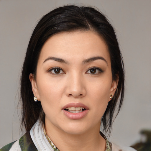 Joyful white young-adult female with medium  brown hair and brown eyes