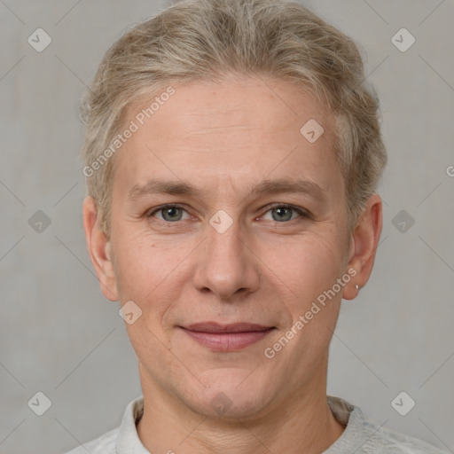 Joyful white adult female with short  brown hair and grey eyes