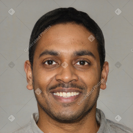 Joyful latino young-adult male with short  black hair and brown eyes
