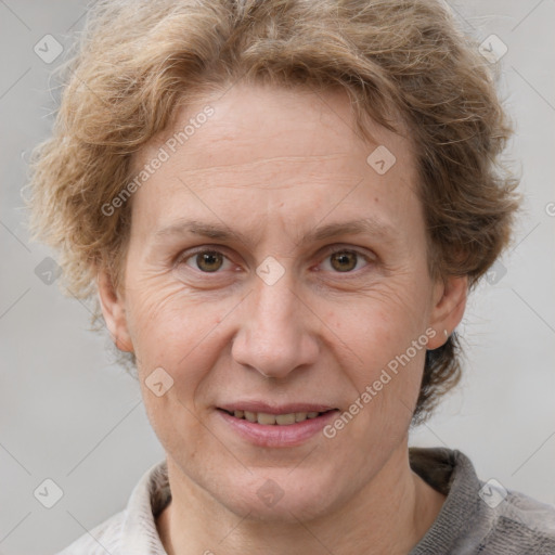 Joyful white adult female with short  brown hair and grey eyes