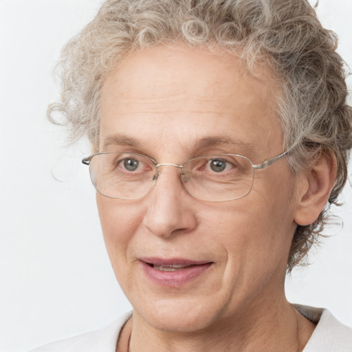 Joyful white middle-aged female with short  brown hair and blue eyes