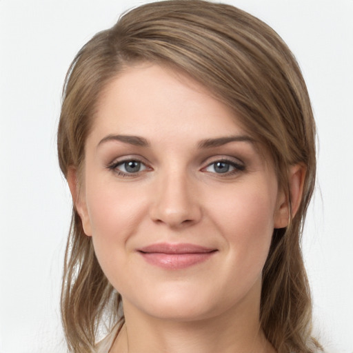 Joyful white young-adult female with long  brown hair and grey eyes