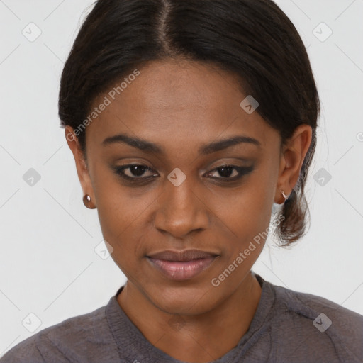 Joyful black young-adult female with medium  black hair and brown eyes