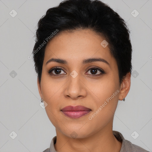 Joyful latino young-adult female with short  black hair and brown eyes