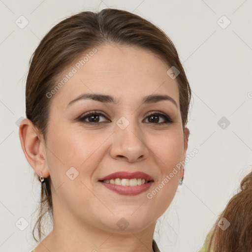 Joyful white young-adult female with medium  brown hair and brown eyes