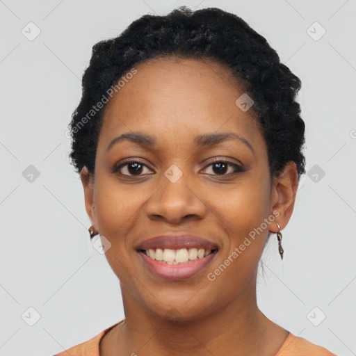 Joyful black young-adult female with short  black hair and brown eyes