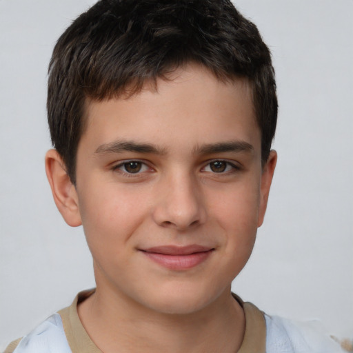 Joyful white child male with short  brown hair and brown eyes