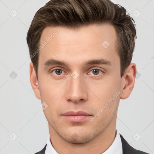 Neutral white young-adult male with short  brown hair and brown eyes