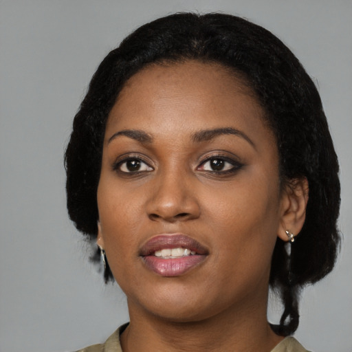 Joyful black young-adult female with medium  black hair and brown eyes