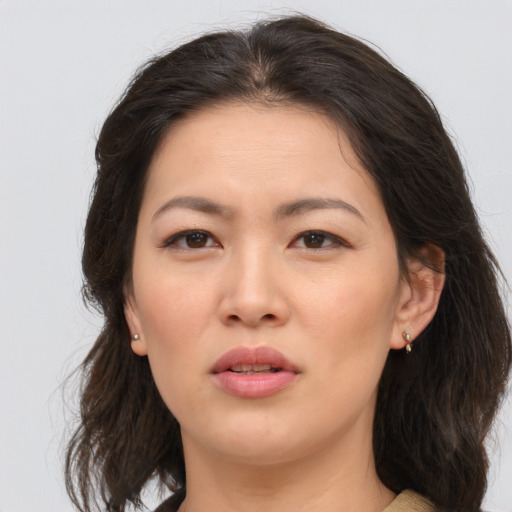 Joyful asian young-adult female with medium  brown hair and brown eyes