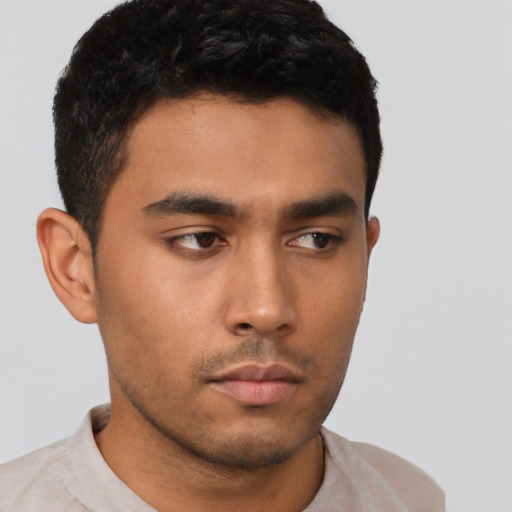 Neutral latino young-adult male with short  brown hair and brown eyes