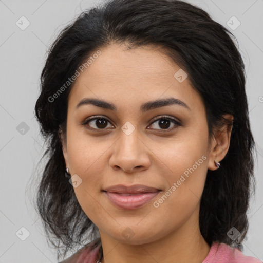 Joyful latino young-adult female with medium  brown hair and brown eyes