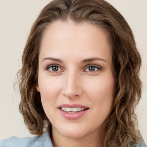 Joyful white young-adult female with medium  brown hair and green eyes