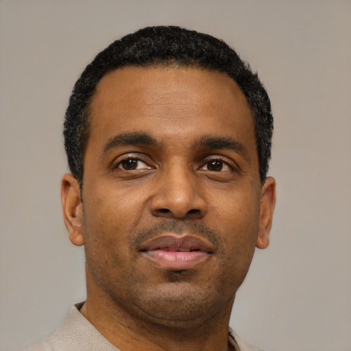 Neutral black young-adult male with short  black hair and brown eyes