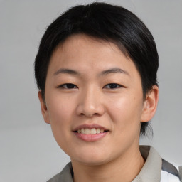 Joyful asian young-adult female with short  brown hair and brown eyes