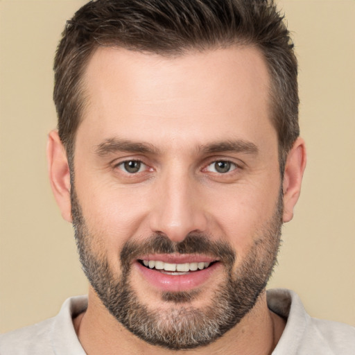 Joyful white young-adult male with short  brown hair and brown eyes