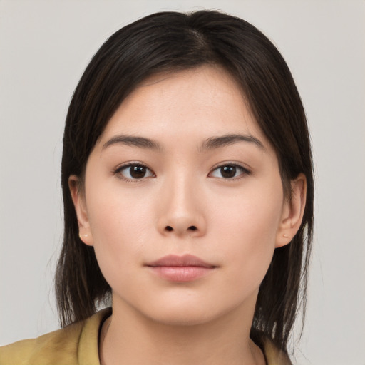 Neutral asian young-adult female with medium  brown hair and brown eyes