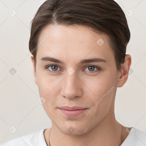 Joyful white young-adult female with short  brown hair and grey eyes