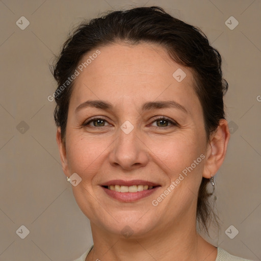 Joyful white adult female with short  brown hair and brown eyes