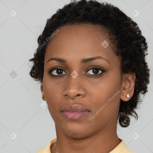 Neutral black young-adult female with short  brown hair and brown eyes