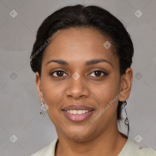 Joyful black young-adult female with short  brown hair and brown eyes