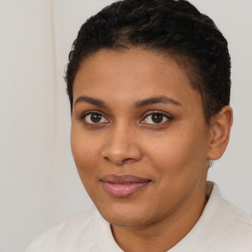 Joyful latino young-adult female with short  black hair and brown eyes