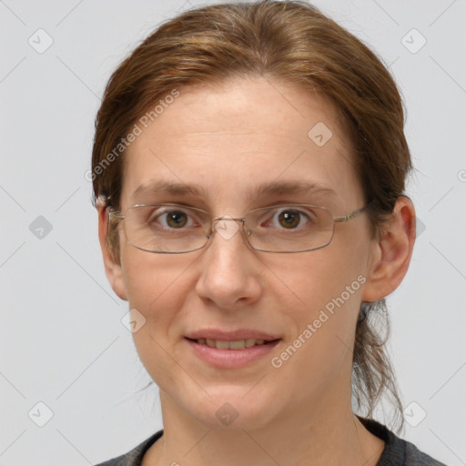 Joyful white adult female with medium  brown hair and grey eyes