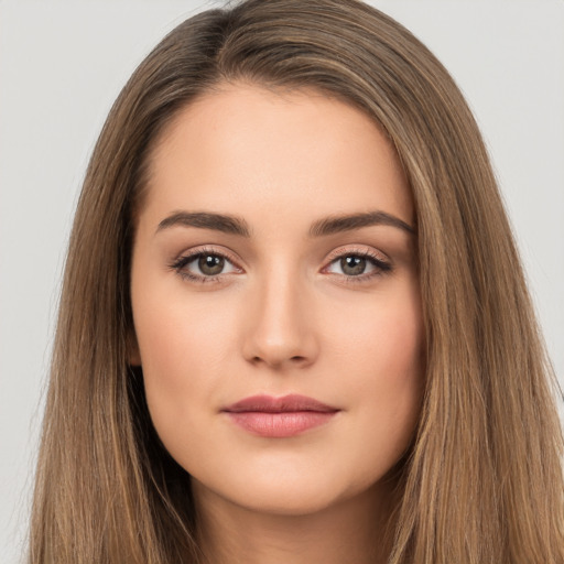 Neutral white young-adult female with long  brown hair and brown eyes