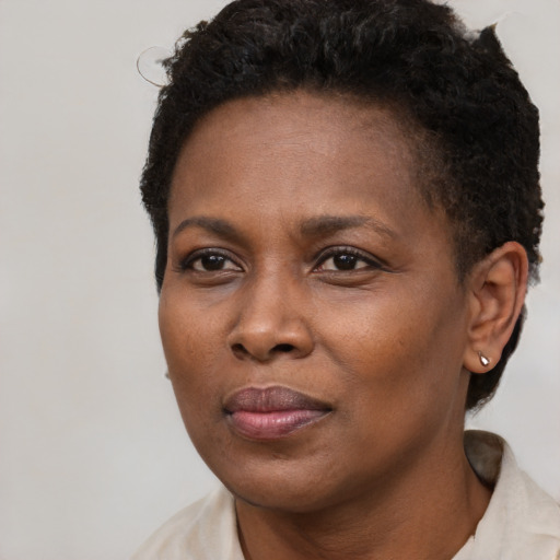 Neutral black adult female with short  brown hair and brown eyes