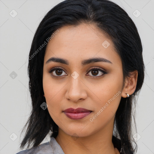 Joyful latino young-adult female with long  black hair and brown eyes