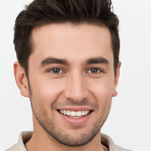 Joyful white young-adult male with short  brown hair and brown eyes