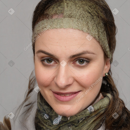 Joyful white young-adult female with medium  brown hair and blue eyes