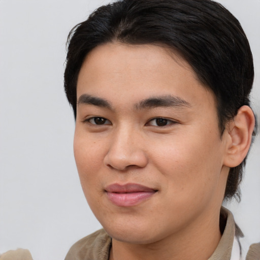 Joyful white young-adult male with medium  brown hair and brown eyes