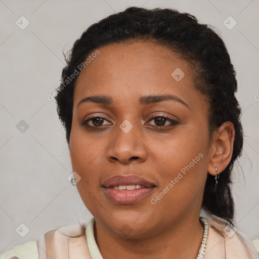 Joyful black young-adult female with short  black hair and brown eyes