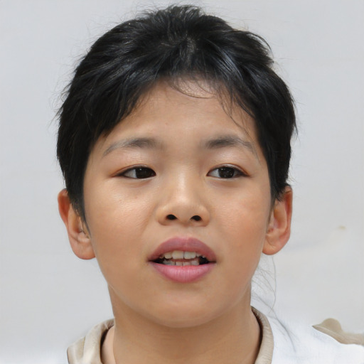 Joyful asian child female with short  brown hair and brown eyes