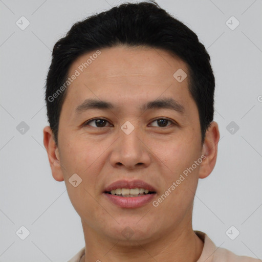 Joyful asian young-adult male with short  black hair and brown eyes