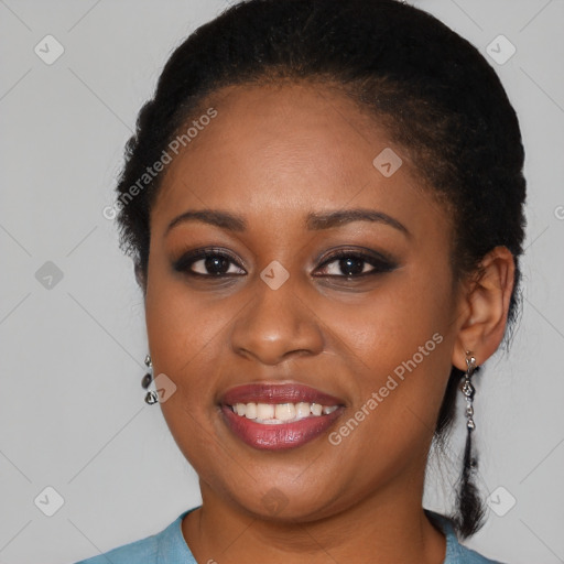 Joyful black young-adult female with long  brown hair and brown eyes