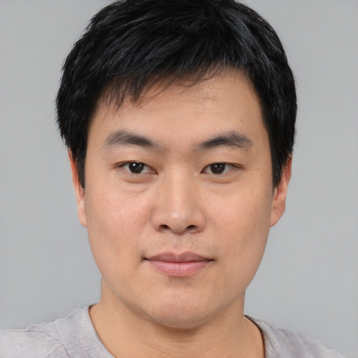 Neutral asian young-adult male with short  black hair and brown eyes