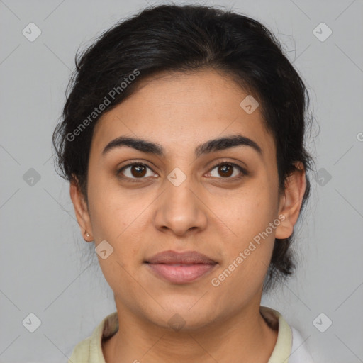 Joyful latino young-adult female with medium  brown hair and brown eyes