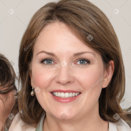 Joyful white young-adult female with medium  brown hair and blue eyes