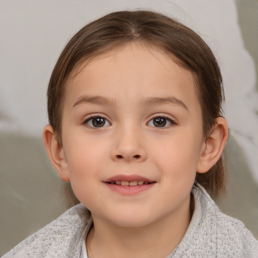 Joyful white child female with medium  brown hair and brown eyes