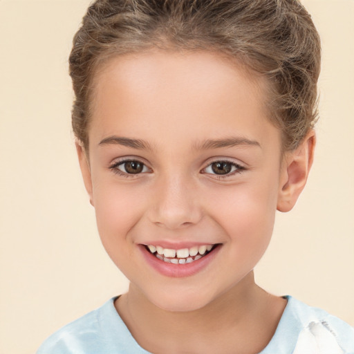 Joyful white child female with short  brown hair and brown eyes