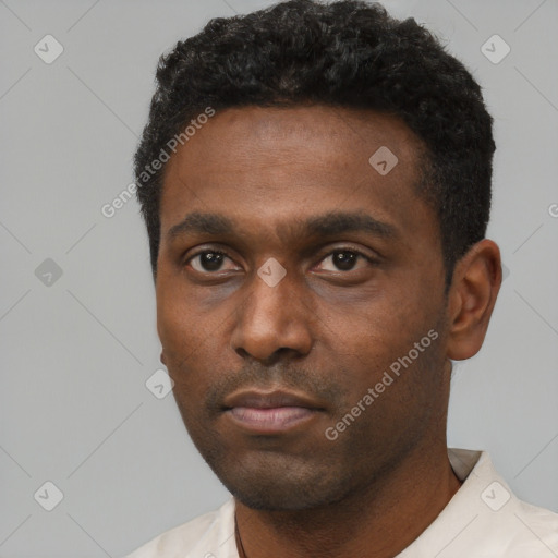 Neutral black young-adult male with short  black hair and brown eyes