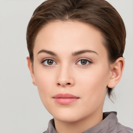 Neutral white young-adult female with medium  brown hair and brown eyes