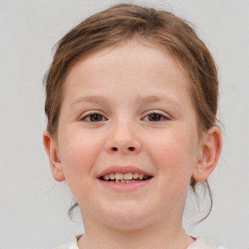 Joyful white child female with medium  brown hair and brown eyes